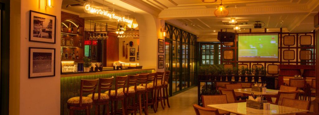 Friends enjoying food and drinks at The Studs sports bar and social club | The Studs