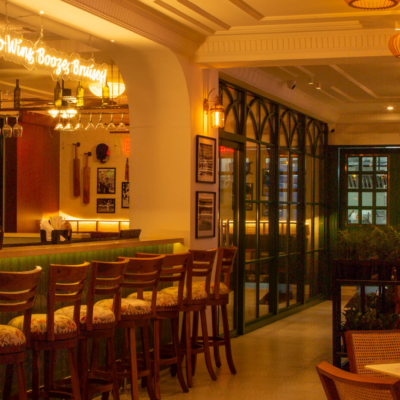 Friends enjoying food and drinks at The Studs sports bar and social club | The Studs